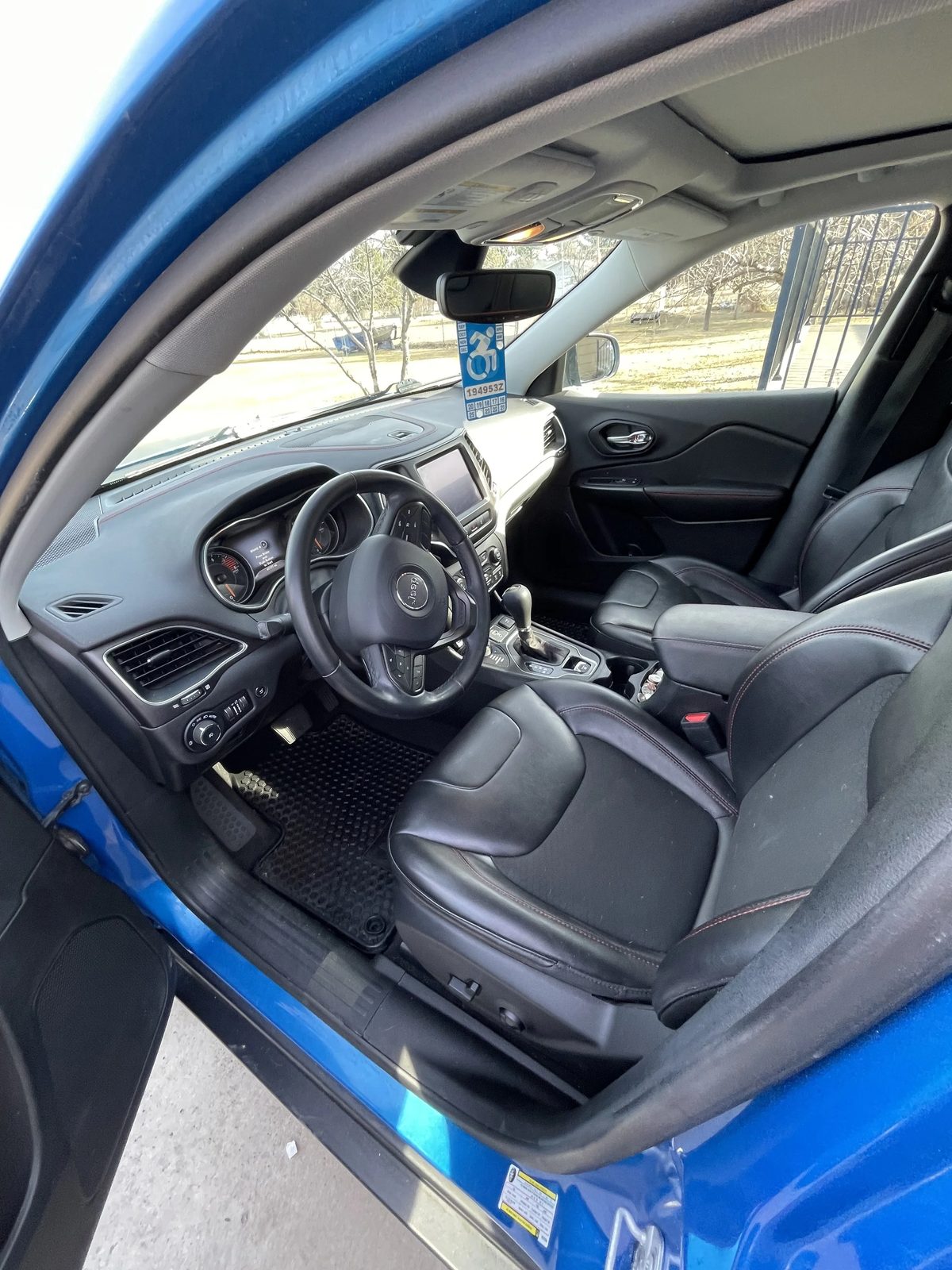 Detailed blue Jeep Cherokee front interior