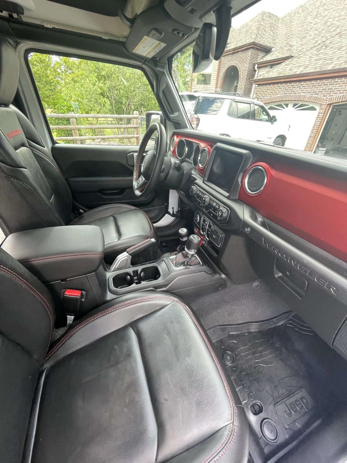 Detailed Jeep Wrangler interior with red accents