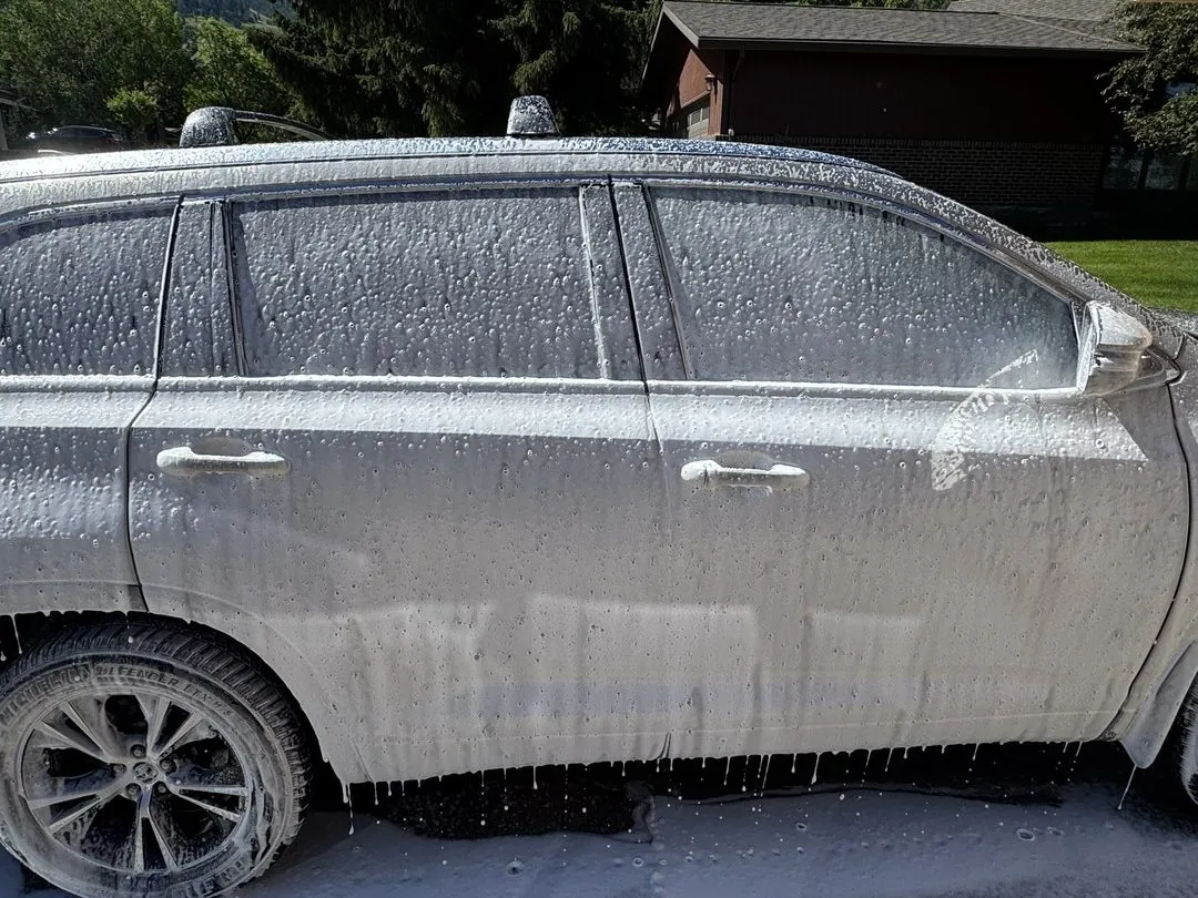 SUV covered in thick foam during an exterior wash by Herd Detailing in Missoula