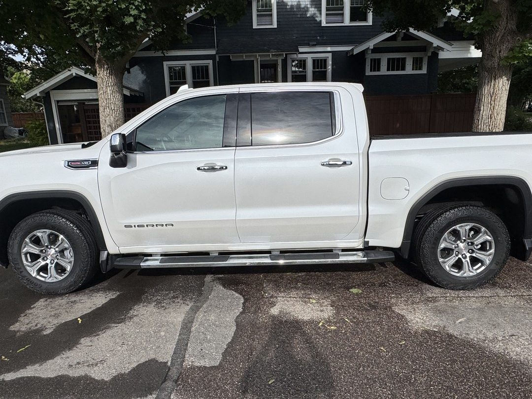 Spotless white GMC Sierra truck with a glossy finish, detailed by Herd Detailing in Missoula