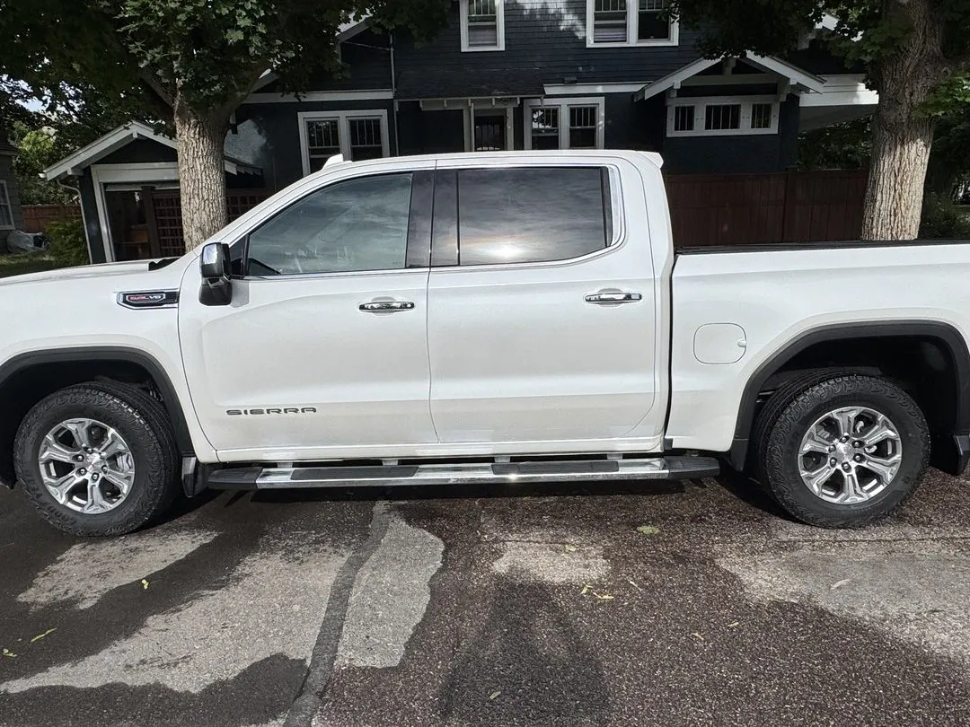 Spotless white GMC Sierra truck with a glossy finish, detailed by Herd Detailing in Missoula